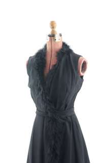 Unique late 1950s early 1960s black dress. Dress is made out of a 