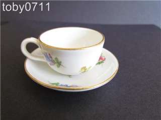 The cup measures 1 high and the saucer measures 2 5/8  diameter.