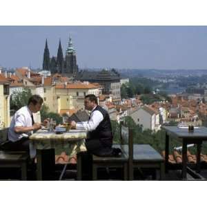  Two Men Having Lunch Outdoors, Enjoying the View of Prague 