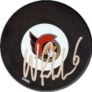 Wade Redden autographed Hockey Puck (Ottawa Senators)