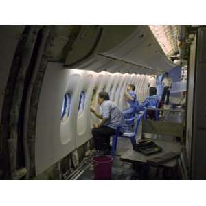  Engineers Working on the Interior of an Aircraft 