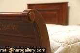 pair of 1900 era twin size sleigh beds are mahogany with subtle 