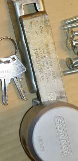 Schalge hockey puck lock, 2 keys, bar hasp, carriage bolts, nuts 