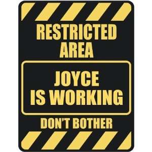   RESTRICTED AREA JOYCE IS WORKING  PARKING SIGN