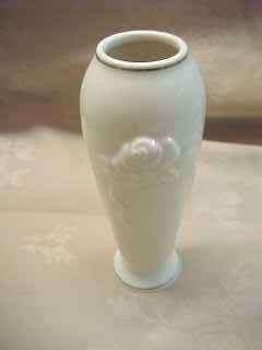 Here is a Lenox Bone Floral Bud Vase . It measures approx. 5 3/4tall 