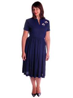   dress very simple 1940s style with short sleeves shoulder pads and a