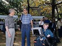   outside, in his wheelchair, talking to David Gross and Edward Witten