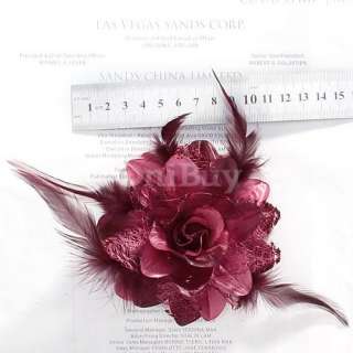 Charming rose style hair flower with color coordinating feather 
