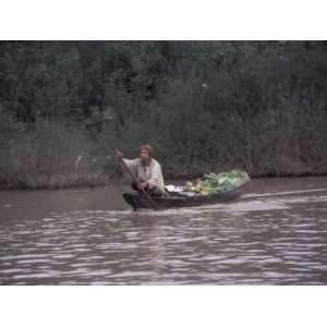  Man with Produce Filled Canoe in Largest Freshwater Lake 