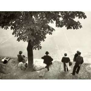 Little Girl with Group of Fishermen Gathered around a Tree Premium 